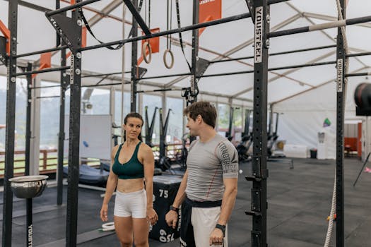 Lacrosse coach demonstrating proper equipment fitting