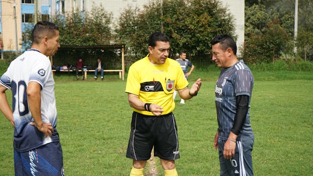 officials discussing game strategy